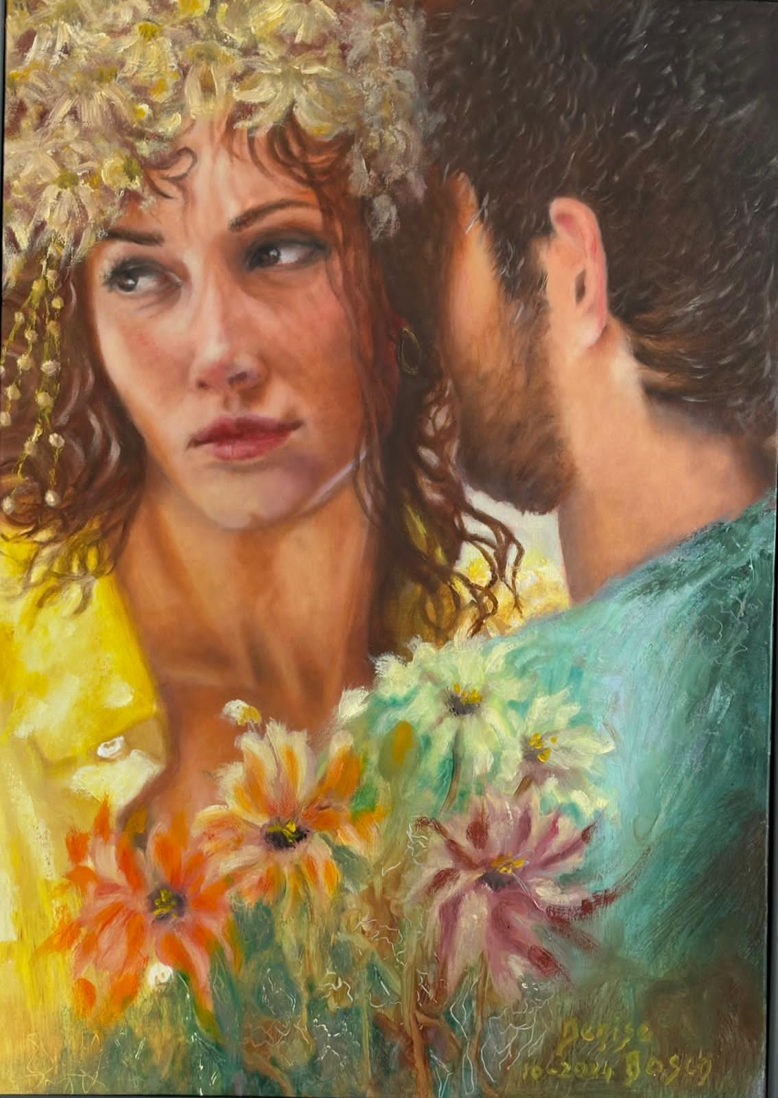 A woman with curly blond hair hugging a man in a green shirt and holding a bunch of flowers.